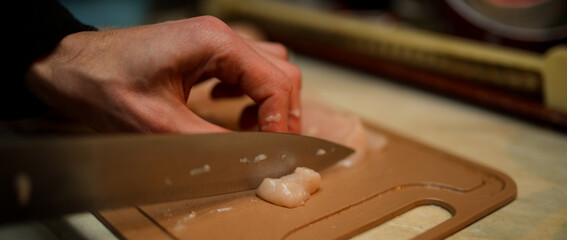 Raw chicken fillet.Raw chicken. Chicken fillets on a cutting board against the background. Meat chicken ingredients for cooking. Top view. food.