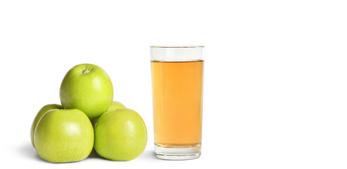Ripe green apples and a glass of juice on a white isolated background with text space.