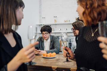 Handsome business people talking in office kitchen