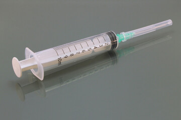 Syringe with needle guard isolated. Medical supplies for vaccination and injection.