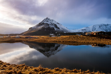 Icelandic landscape with lake and stapafell mountains covered in snow at snaefellsnes peninsula in...