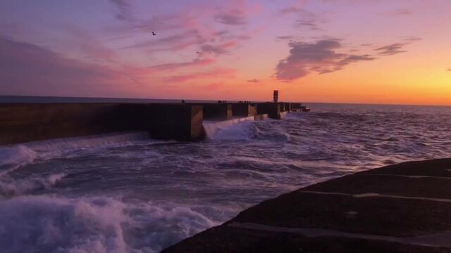 Scenic sunset over Atlantic Ocean. View from Felgueiras Lighthouse in Foz do Douro district of Porto city, Portugal at sundown.