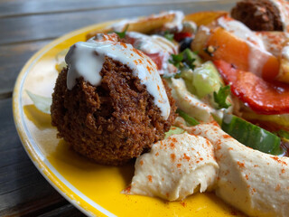 Falafel with hummus and vegetables on a plate