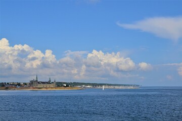Fototapeta premium Denmark. Landscape in blue tones of the sky and water. The coast of Copenhagen is visible in the distance