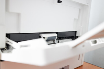 workplace with close up view to copy machine at office. paperwork, stationery and procrastination concept.