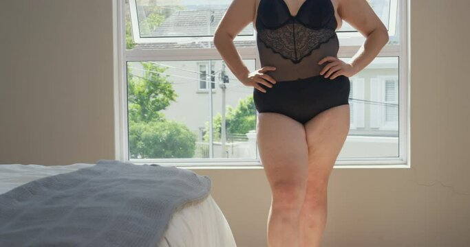 MS TU Woman wearing lace bodysuit standing in bedroom / Claremont, Cape Town, South Africa