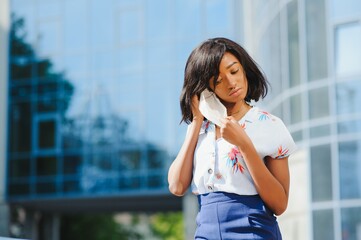 Close up Young Afro-American Businesswoman Wearing Protecting Mask, Staring at the Camera.