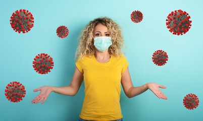 Blonde girl has doubt about covid19 corona virus. Cyan background