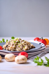 Mushroom risotto garnished with fresh parsley and grated parmesan.