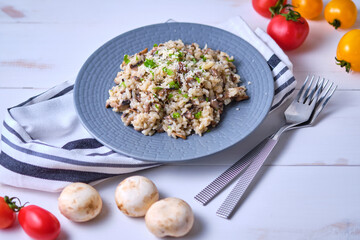 Mushroom risotto garnished with fresh parsley and grated parmesan.