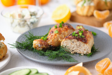 Chicken legs stuffed with meat, mushrooms and cheese. Tasty and beautiful dish on the holiday table.