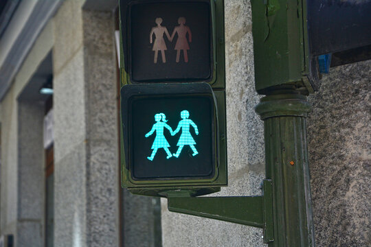 Green traffic light with a lesbian same-sex couple