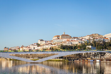 Fototapeta na wymiar historic Coimbra cityscape with university at top of the hill in the evening, Portugal