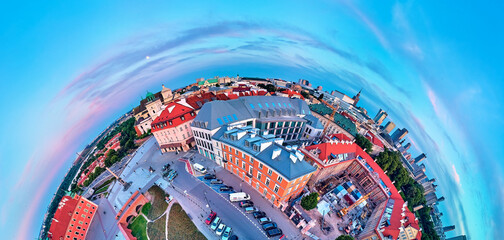Beautiful panoramic aerial drone view (360 spherical panorama little planet)) on Warsaw Old town (POL: (Stare Miasto), Royal Castle, square and the Column of Sigismund III Vasa at sunset, Poland