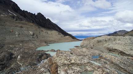 Aerial view of the turquoise water lake in Vinciguerra glacier mountaintop. 