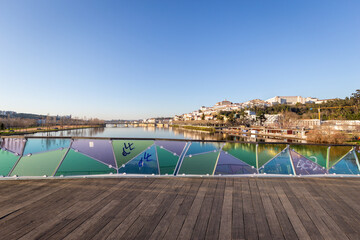 historic Coimbra cityscape with university at top of the hill in the evening, Portugal