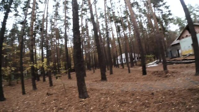 Larp player with black sleeves in leather gloves is spinning two swords. The first-person view is showing actor's hands holding weapon and moving it rapidly. Theme of larp and it's actors.