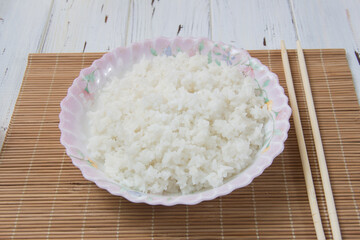 boiled rice with close-up on a light background