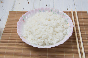 boiled rice closeup on a light background. Vegetarian food. Healthy eating