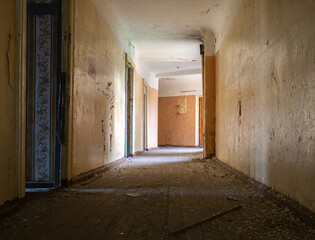 Empty bright corridor in an abandoned building