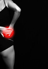 Fototapeta premium Woman pain back. Pain. Dark background. Woman back. 