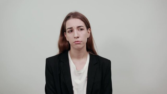 Upset offended looking big eyes, blowing cheeks being annoyed after quarrel with her husband, inflating not wanting to do something, bad mood, fascinating, cut, pouted. Young attractive woman