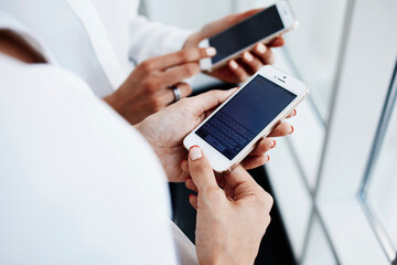  Females is reading on cell telephone financial news