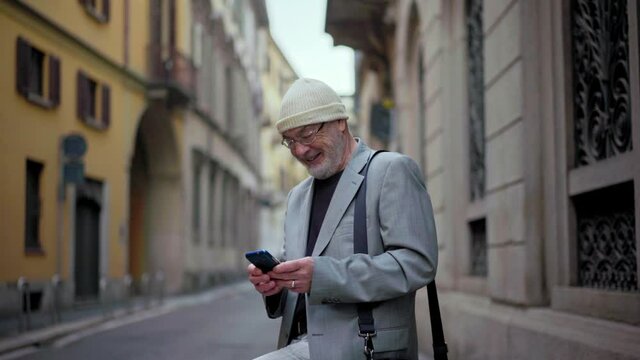  Senior man using smart phone
