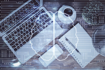 Double exposure of brain drawing hologram over topview work table background with computer. Concept of big data.