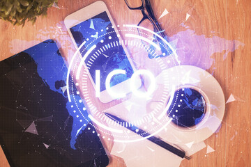 Double exposure of blockchain theme hologram over table with phone. Top view. Crypto technology concept.