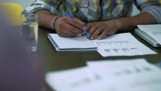  Businessman writing in note pad