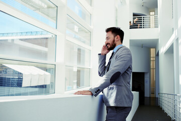 Intelligent male lawyer working on touch pad during work break