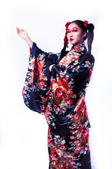 young pretty geisha in black kimono with sakura, asian ethno closeup on white background isolated