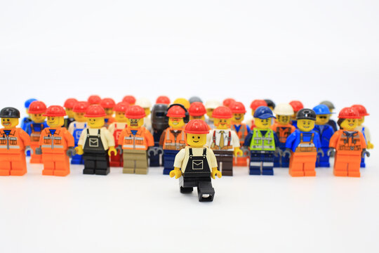 HONG KONG, NOV 2: A group of workers lego mini characters from different genation which are isolated on white in hong kong on 2 november 2014. Lego minifigure are the successful line in Lego products 