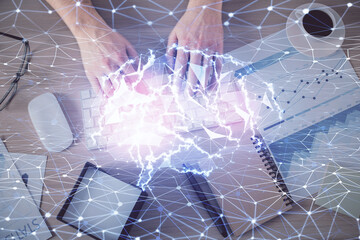 Double exposure of man's hands typing over computer keyboard and brain hologram drawing. Top view. Ai and data technology concept.