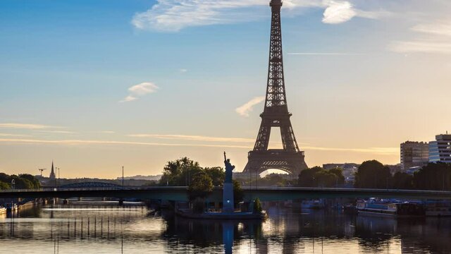 Architecture of Paris with Eiffel Tower, Pont de Grenelle over Seine river and Statue de la Liberte Paris