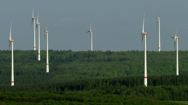 WS Wind turbines at hill overgrown by forest / Cochem, Rhineland-Palatinate, Germany