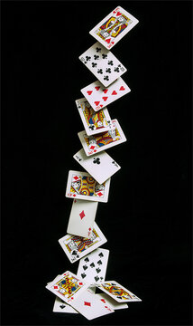 Playing cards falling in a row.