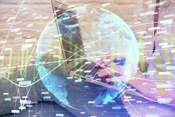 Double exposure of woman hands typing on computer and business theme hologram drawing. Success concept.