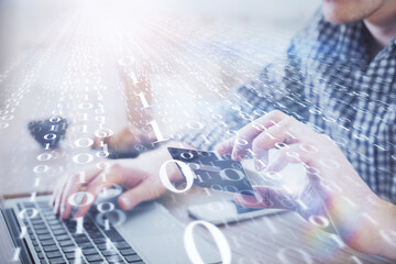 Double exposure of man hands holding a credit card and data theme drawing. E-commerce and technology concept.