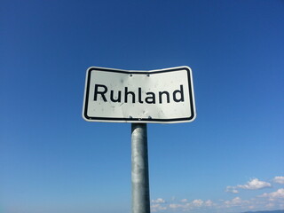 Road sign with blue sky