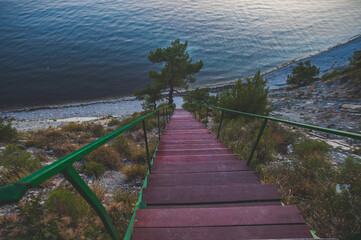 stairs going down the cliff to the sea