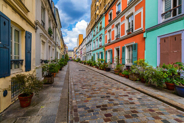 Fototapeta na wymiar Cremieux Street (Rue Cremieux), Paris, France. Rue Cremieux in the 12th Arrondissement is one of the prettiest residential streets in Paris. Colored houses in Rue Cremieux street in Paris. France.