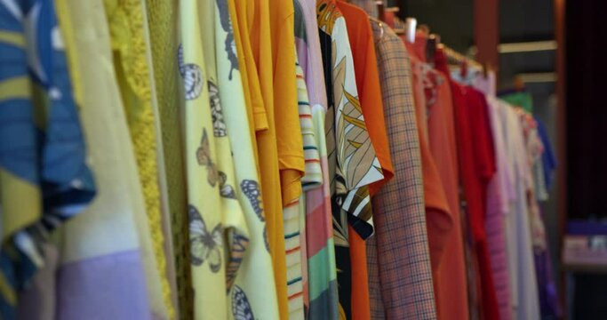 MS R/F Colorful clothing on clothes rack in boutique at King's Cross / London, UK