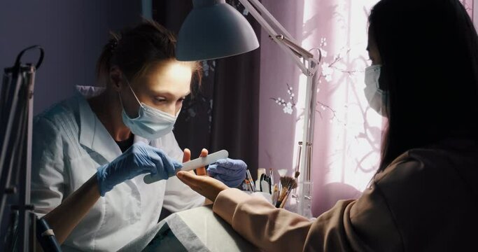 Manicure procedure at home, while beauty salon closed for quarantine. Cutting