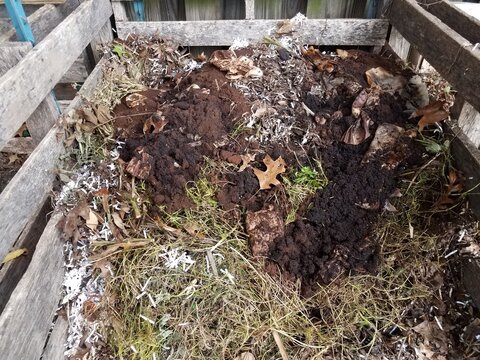 Compost Pile With Dirt And Coffee Grounds And Filters