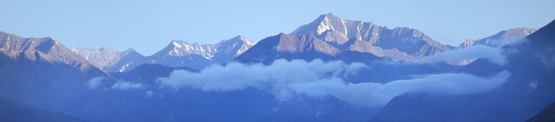 Fototapeta na wymiar Panoramic view of the mountain range, blue haze
