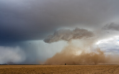 Dust storm forming over a farm field