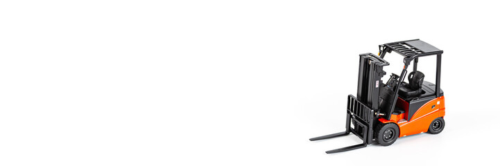 Red toy forklift loader isolated on white background. Horizontal web banner with Copy Space for text. moving service and distribution products. Delivery production. Logistics and industrial concept.