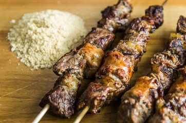 Juicy meat barbecue skewer (Churrasquinho, espetinho) in close up.